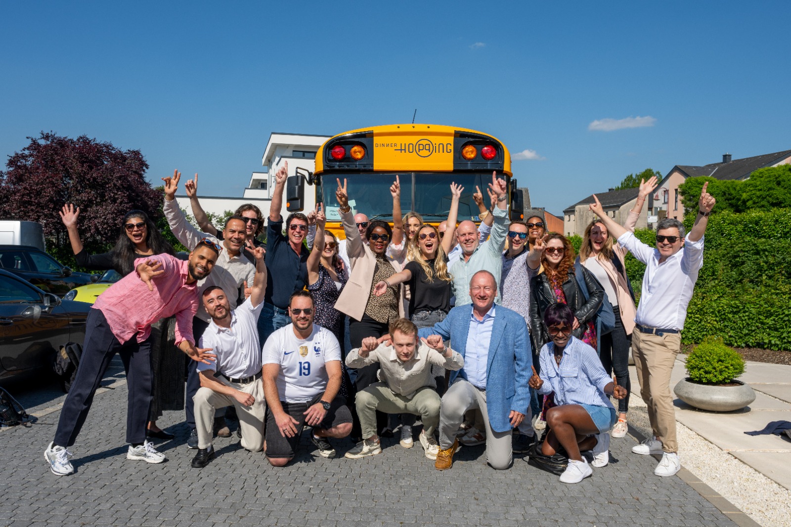 ONE's team by the party bus — a fun TGIF surprise that boosts morale, strengthens bonds, and enriches our work culture.